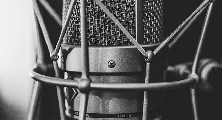 Black and white photo of a professional microphone up close